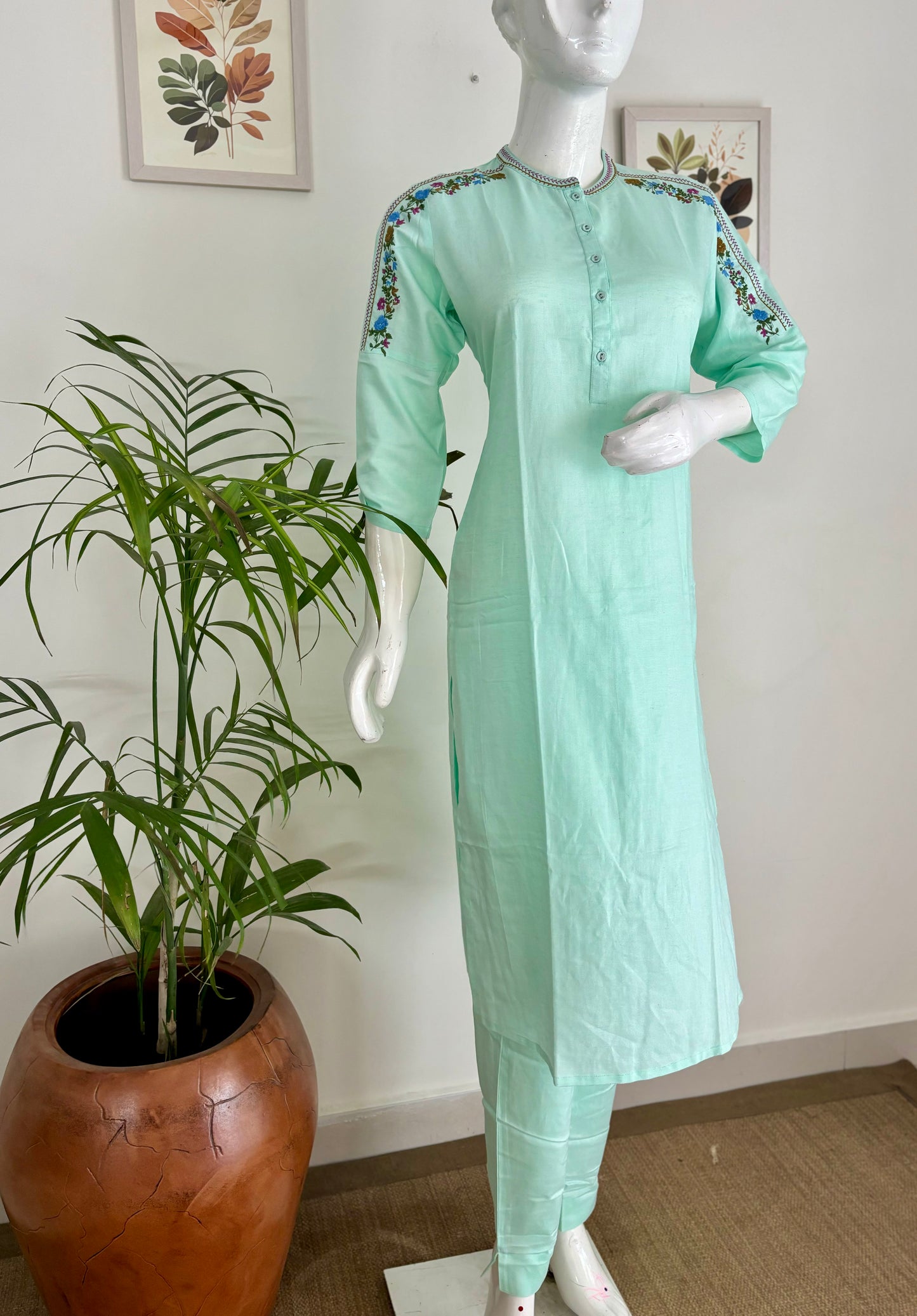 Springtime Chic: The Pastel Green Kurta Set with Playful Embroideries