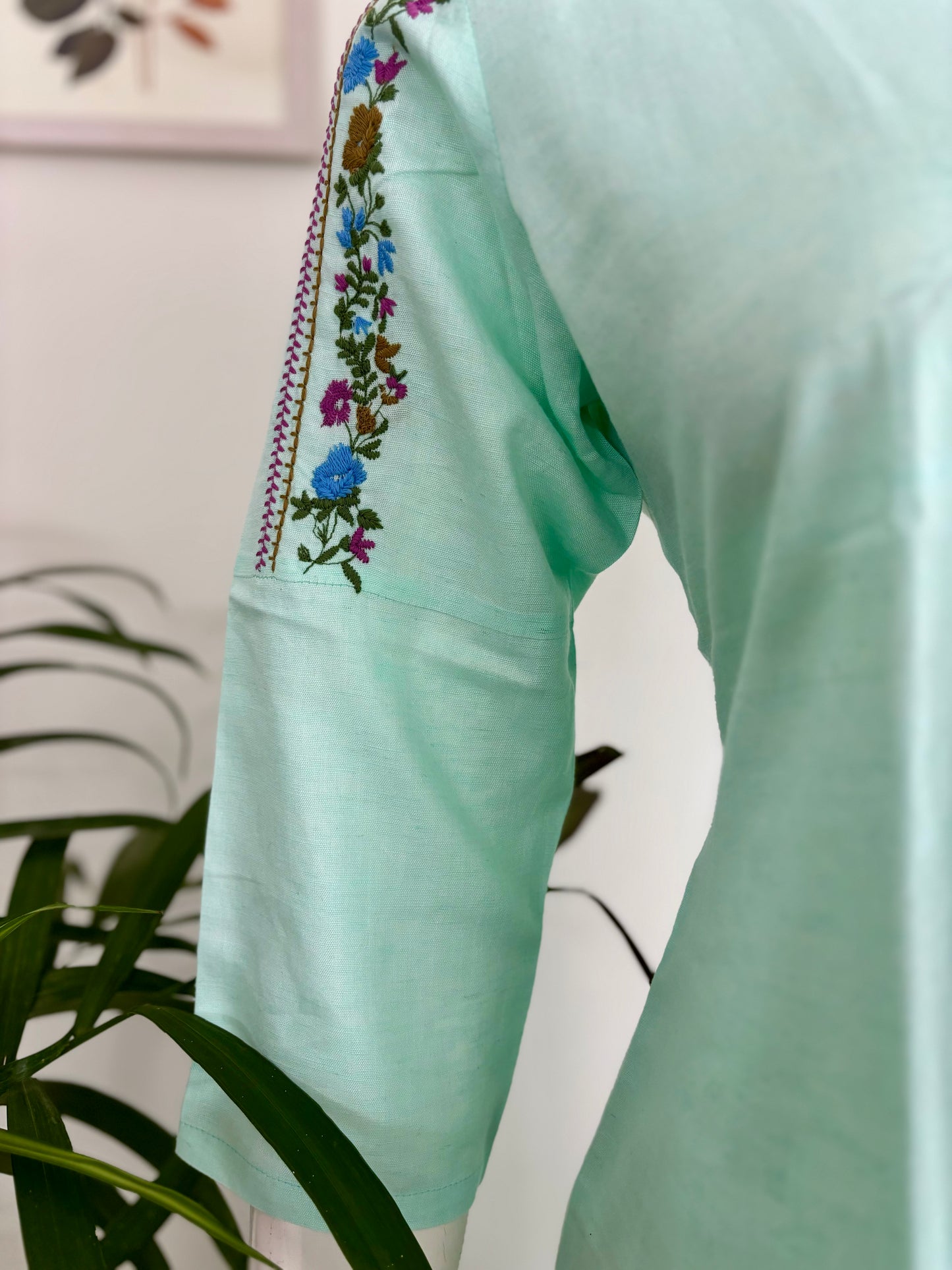 Springtime Chic: The Pastel Green Kurta Set with Playful Embroideries