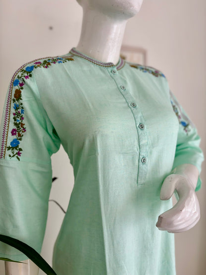 Springtime Chic: The Pastel Green Kurta Set with Playful Embroideries