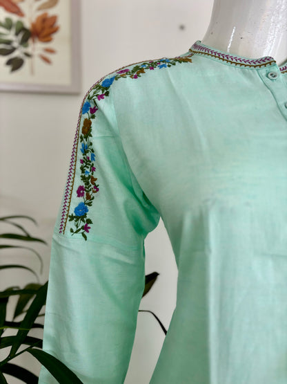 Springtime Chic: The Pastel Green Kurta Set with Playful Embroideries