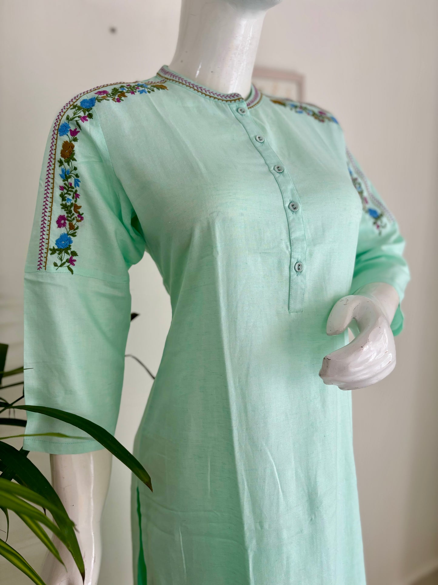 Springtime Chic: The Pastel Green Kurta Set with Playful Embroideries